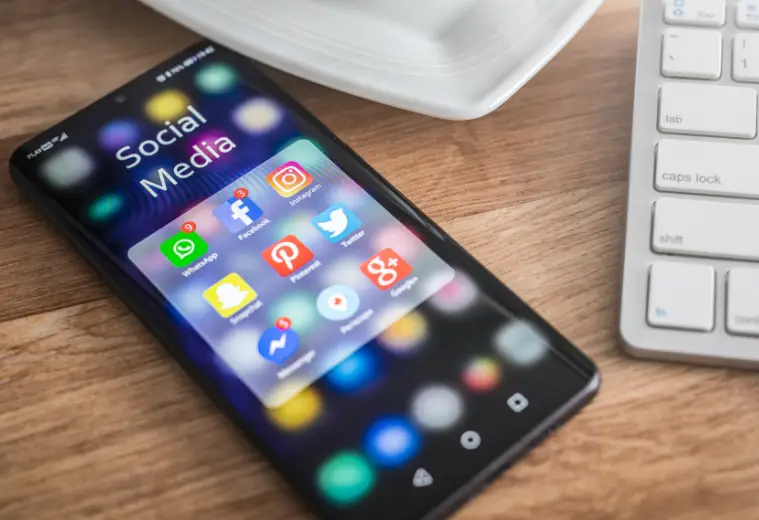 Image of mobile phone with social media icons